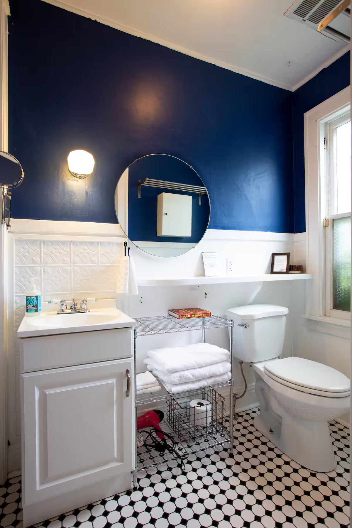 Bathroom with blue walls and hex tile