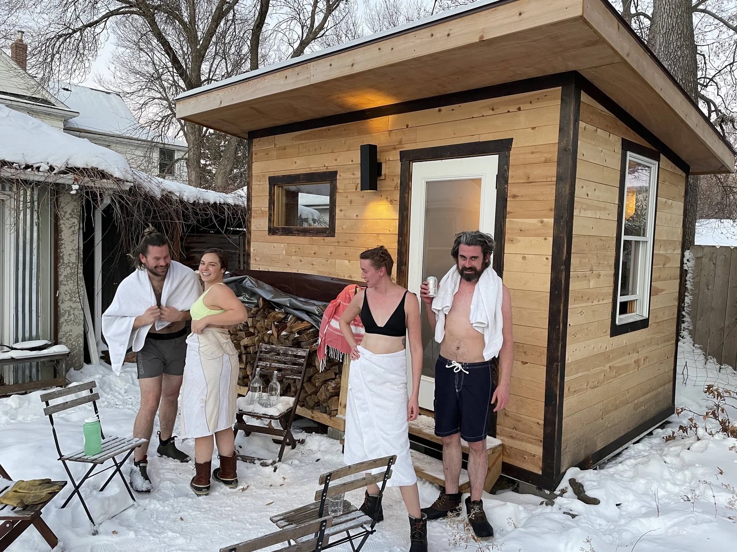 Guests outside the sauna in winter