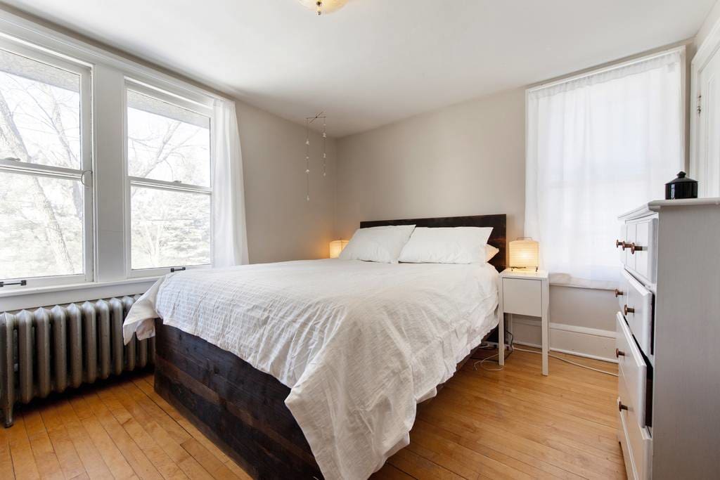 Bedroom with queen bed and natural light