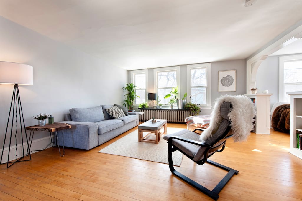 Living room from alternate angle with floor lamp and arch