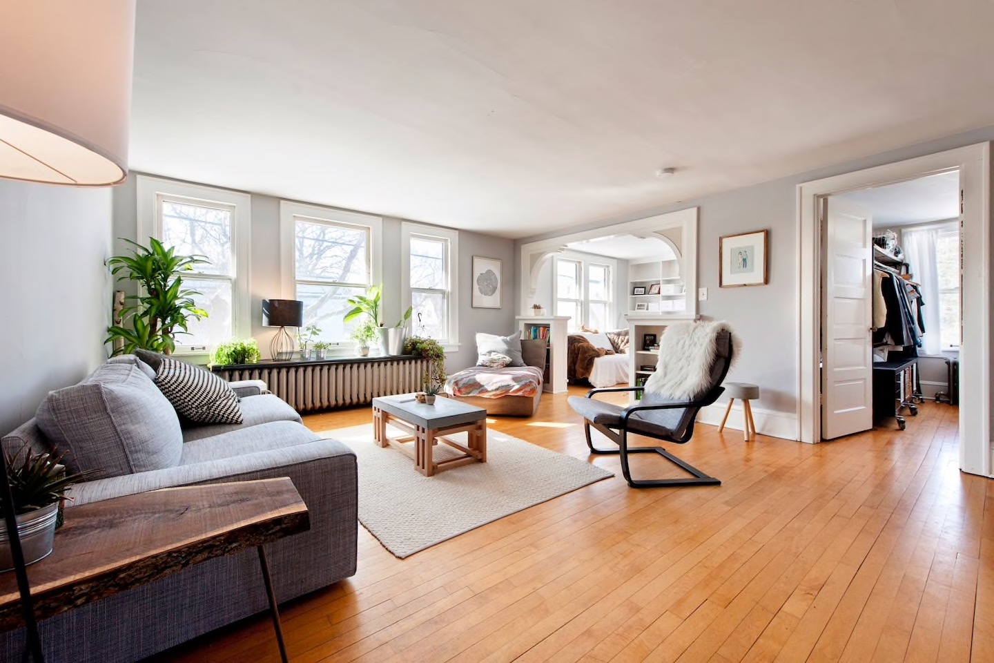 The Loft — bright open living room with hardwood floors